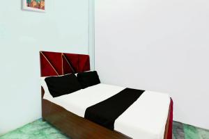 Ένα ή περισσότερα κρεβάτια σε δωμάτιο στο SPOT ON A M HOTEL