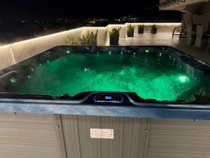 a jacuzzi tub on top of a building at Premium Apartment in Craiova