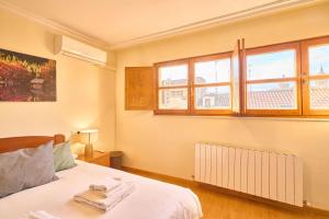 Ένα ή περισσότερα κρεβάτια σε δωμάτιο στο San Justo Suites