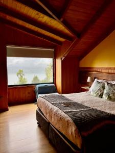 Postel nebo postele na pokoji v ubytování La Rueda del Chucao