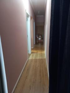 an empty hallway with a hallway leading into a room at Casa com piscina aquecida e área de festas no litoral in Ilhota +4 photos