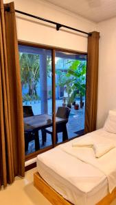 Postel nebo postele na pokoji v ubytování Celeste Thoddoo Maldives