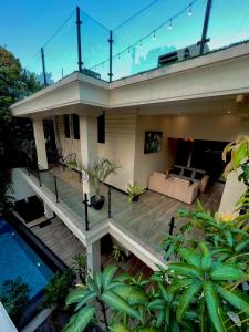 a house with a deck and a swimming pool at The Castle By Scenic Weligama in Weligama +51 photos