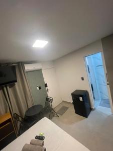 TV a/nebo společenská místnost v ubytování Flats SP Vila Olímpia