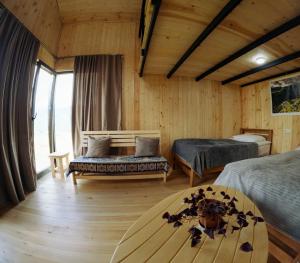 Ένα ή περισσότερα κρεβάτια σε δωμάτιο στο Guesthouse Omalo