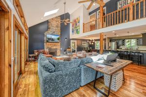 a living room with a couch and a table at Avoca Cove in Spotsylvania
