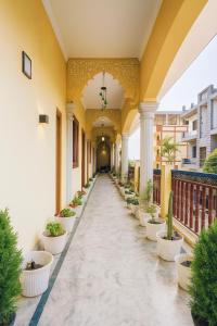 a hallway of a building with a row of plants at Hidden Leaf in Dehradun