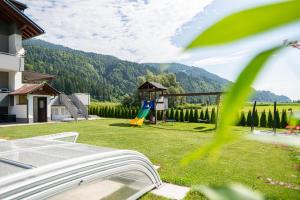a view of a yard with a playground at Nico's Place in Jenig
