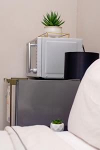 Postel nebo postele na pokoji v ubytování Ekhaya Lodge