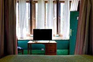 TV a/nebo společenská místnost v ubytování La Canonica dei Fiori - Anna Fendi Country House