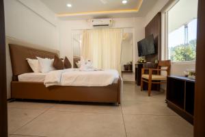 Postel nebo postele na pokoji v ubytování Eeleem Resorts and Spa, Munnar + 28 fotografií