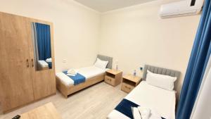 Ένα ή περισσότερα κρεβάτια σε δωμάτιο στο Anhor INN Hotel with Sauna&Pool