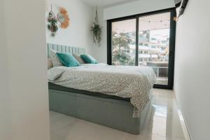 a bedroom with a bed and a large window at Casa Madie - Sea view in Orihuela Costa +21 photos
