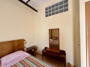 Postel nebo postele na pokoji v ubytování Dimora - L antico Fienile del Castello