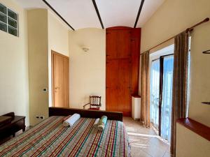 Postel nebo postele na pokoji v ubytování Dimora - L antico Fienile del Castello