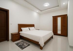 Ένα ή περισσότερα κρεβάτια σε δωμάτιο στο Villa Serenite