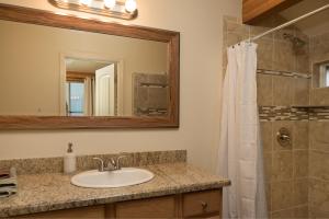 a bathroom with a sink and a shower at Ontario Ave Remodeled Log Cabin on 1 Acre Gateway to Grand Canyon Amazing Views in Williams +28 photos