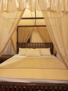 Postel nebo postele na pokoji v ubytování Aura Hilltop Holiday Homestay