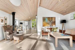 a living room with a couch and a table at 2502-Nexo-Gubbegardsvejen-31 in Neksø