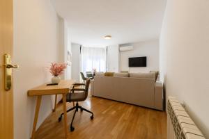 TV a/nebo společenská místnost v ubytování Vivienda con estilo 2 dormitorios, Piscina y todo el confort Temporal HOR1K1B