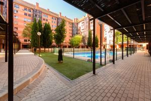 Bazén v ubytování Vivienda con estilo 2 dormitorios, Piscina y todo el confort Temporal HOR1K1B nebo v jeho okolí