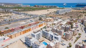 an aerial view of a city with a beach and buildings at Centrally located and comfortable apartment! in Cabo San Lucas