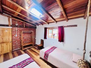 Postel nebo postele na pokoji v ubytování Stone house in Ollantaytambo