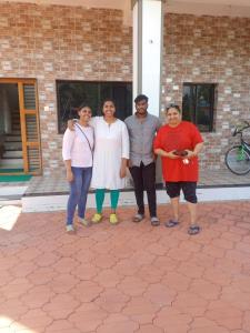 a group of people standing in front of a building at Mystique Copper Smart Villa in Sadāshivgarh