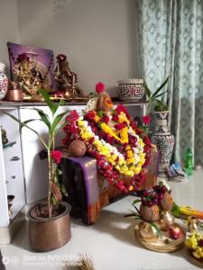 a room with a couch covered in flowers at Mystique Copper Smart Villa in Sadāshivgarh