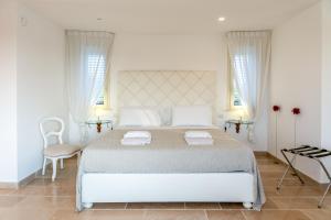 En eller flere senge i et værelse på Villa Anciletta