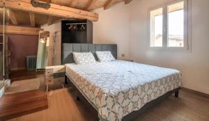 a bedroom with a bed and a window at Chalet d'Aussois Lerovi in Aussois