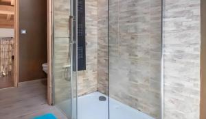 a shower with a glass door in a bathroom at Chalet d'Aussois Lerovi in Aussois +22 photos