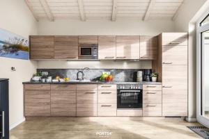 Kuchyň nebo kuchyňský kout v ubytování Ferienhaus Tingeltuthus Dagebüll