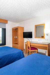 Postel nebo postele na pokoji v ubytování Hotel Galerías Express