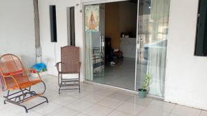 two chairs and a mirror on a patio at cop30 Belém in Belém