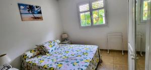 Postel nebo postele na pokoji v ubytování les jardins de sainte Anne