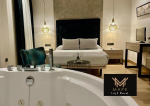 En eller flere senge i et værelse på Mape Loft Rural Aljibe