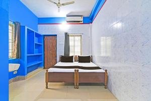 Ένα ή περισσότερα κρεβάτια σε δωμάτιο στο Hotel O New Cuttack Guest House
