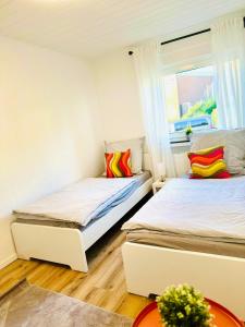 Ένα ή περισσότερα κρεβάτια σε δωμάτιο στο MOLA Apartments - Panoramablick, Balkon, 5 Pers, Bahnhofsnähe, Parkplatz