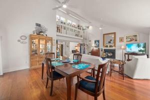 a dining room and living room with a table and chairs at The Turtle Nest in Sanibel