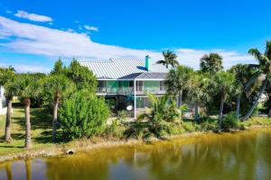 an aerial view of a house with palm trees at The Turtle Nest in Sanibel