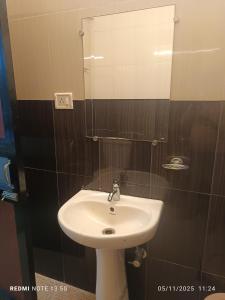 a bathroom with a sink and a mirror at Jacinta's - By the beach - Cruz's place in Calangute