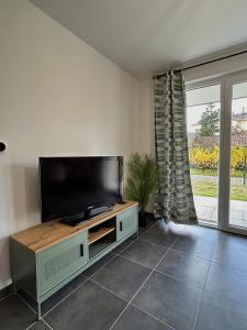 Et tv og/eller underholdning på Appartement moderne - Sur le sentier des vignes