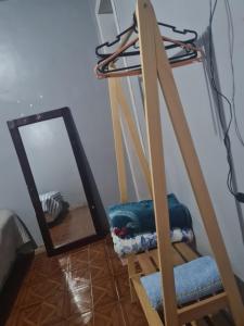 a ladder with a mirror in a room at Pousada Pôr do Sol in Belém