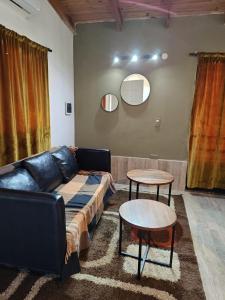 a living room with a couch and a table at Beautiful Quinta in Corrientes in Paso de la Patria