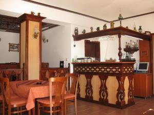 a dining room with a table and a table and chairs at Sivrieva House in Zlatograd