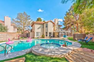 a swimming pool in the yard of a house at Vila Sol in Las Vegas