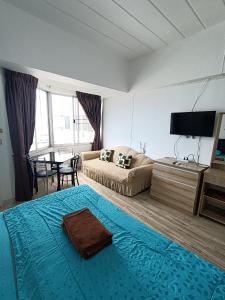 Postel nebo postele na pokoji v ubytování Thiantong Condotel Seaview -12 + 23 fotografií