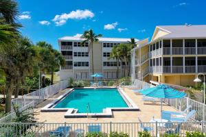a swimming pool in front of a building at Surfside 12 A4 in Sanibel
