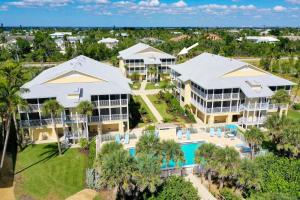 an aerial view of a resort with a pool and palm trees at Surfside 12 A4 in Sanibel